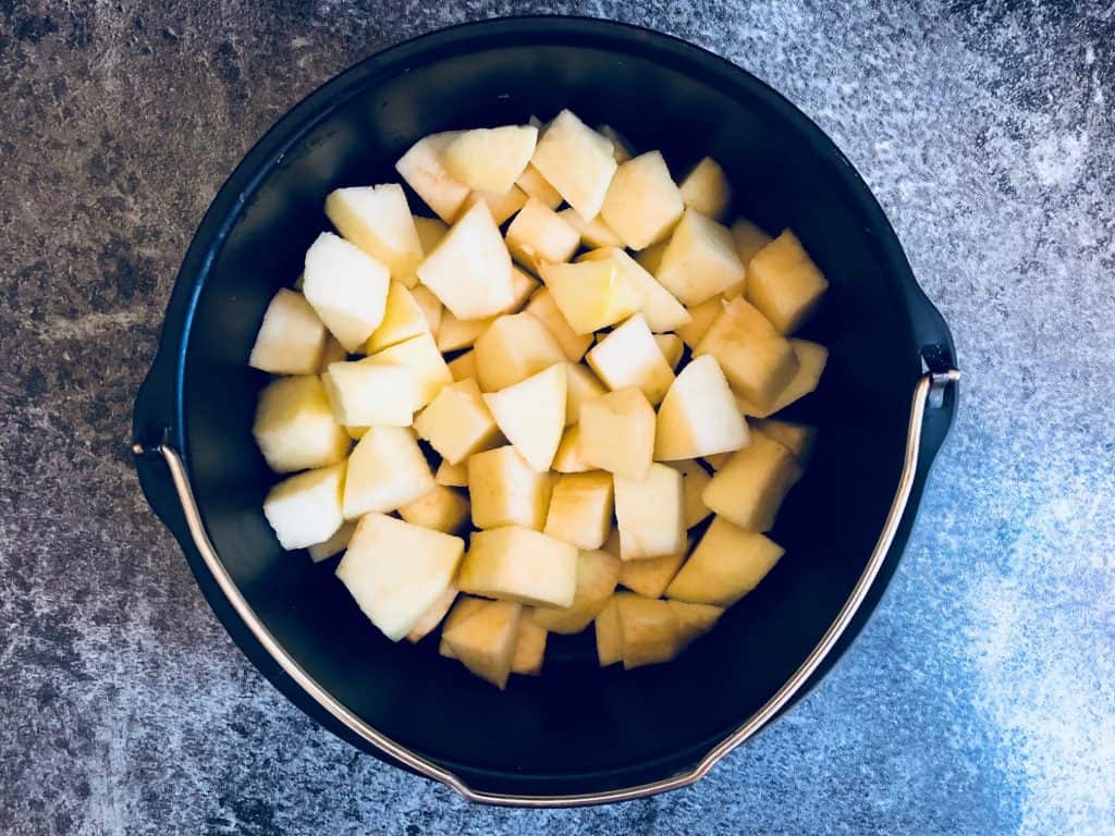Bramley apples chopped up and in a baking tin