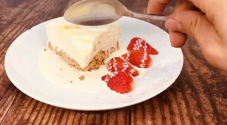 eating no bake lemon cheesecake with strawberries