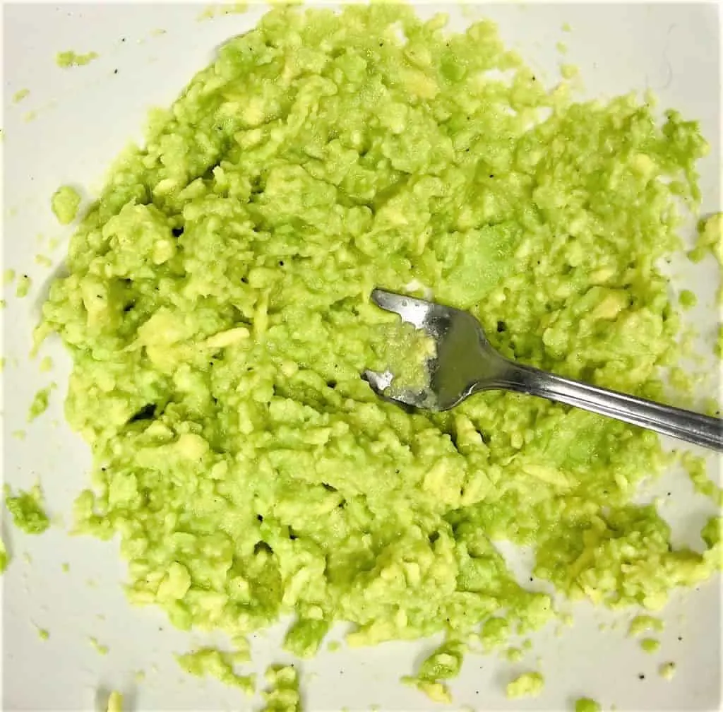 mashing up avocado for avocado toast