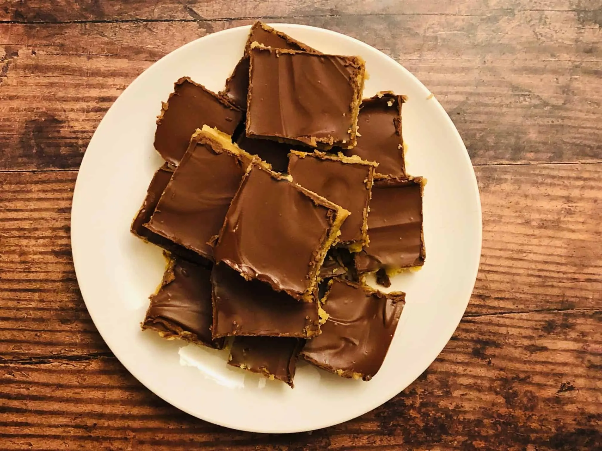 Millionaire shortbread sliced up on a plate