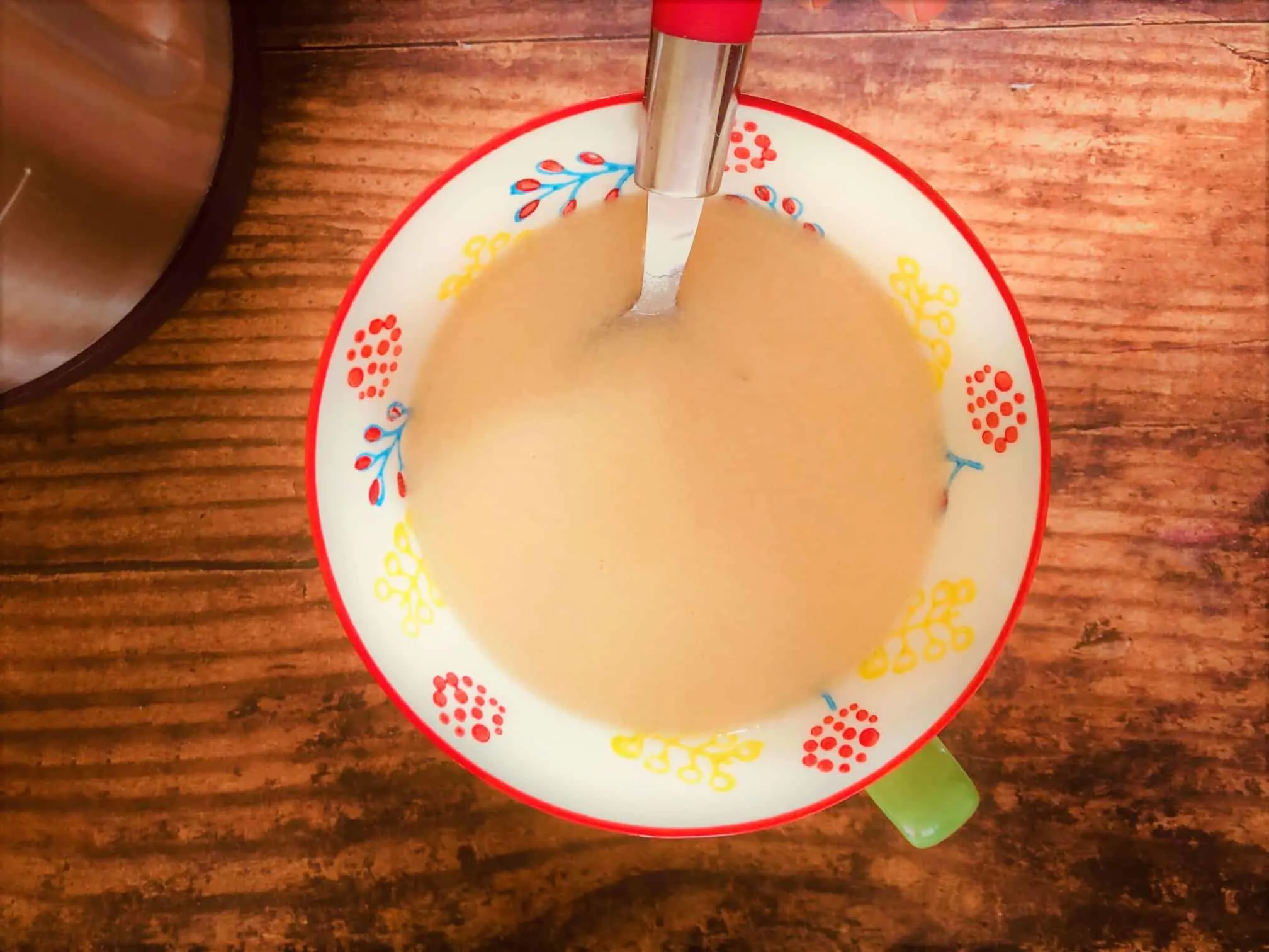 chicken soup in a bowl with spoon