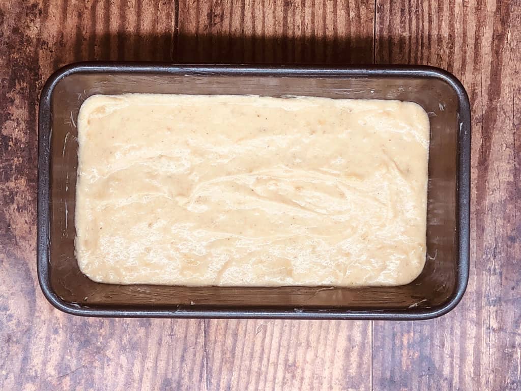 banana bread mixture in loaf tin ready to bake in the oven