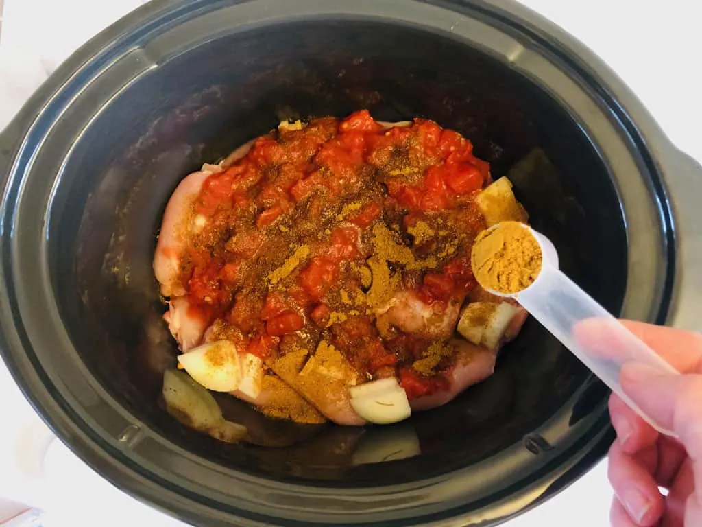 adding spices to slow cooker