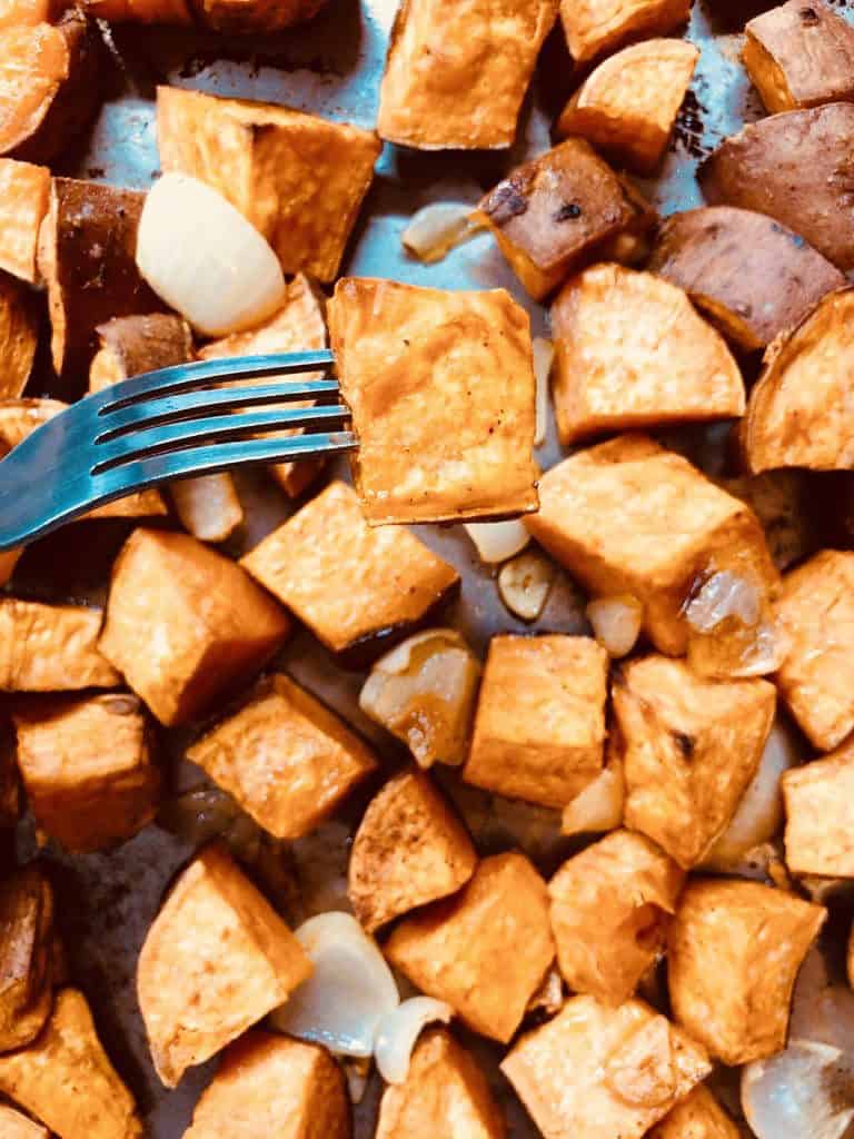 sweet potato on a fork after baking