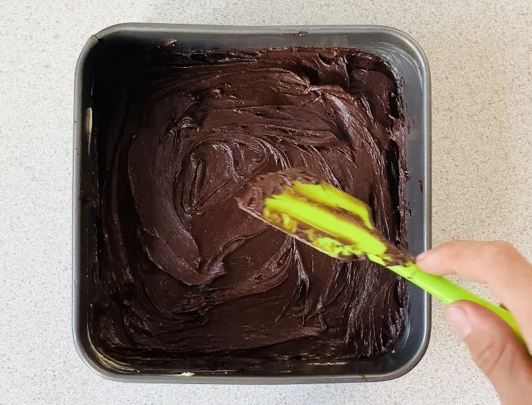 brownie batter in a baking tin