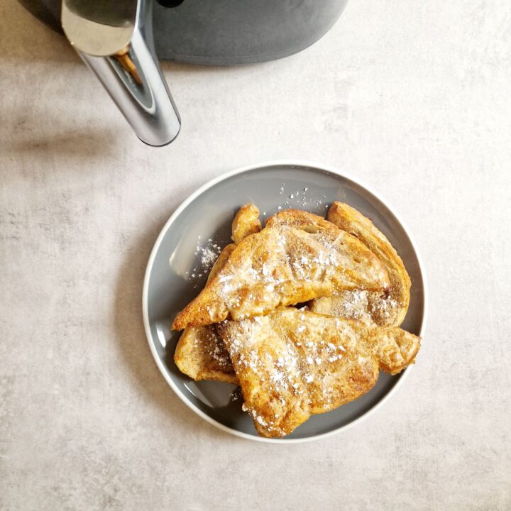 slices of French toast next to air fryer