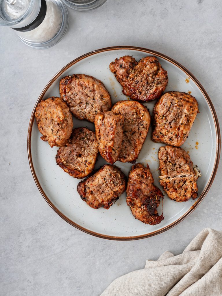 air fried garlic pork medallions on a plate