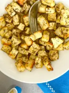 air fryer halloumi bites on a plate with a fork