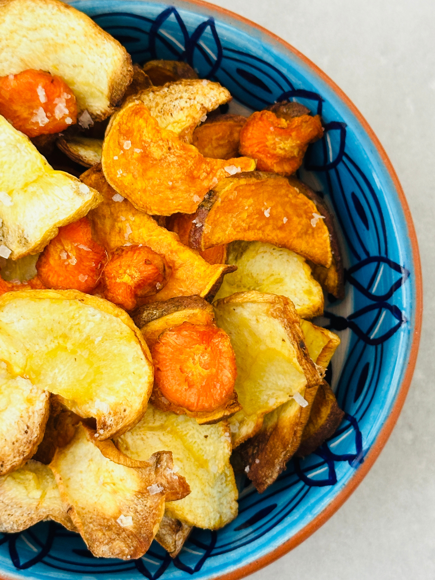 Air Fryer Vegetable Crisps served in a blue bowl