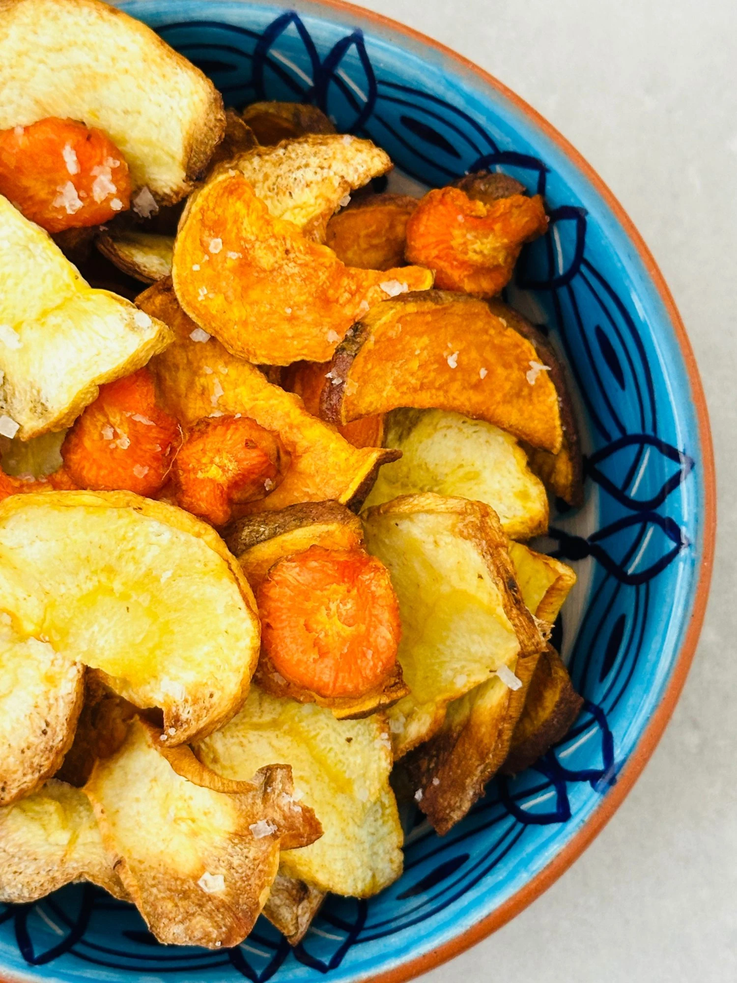Air Fryer Vegetable Crisps served in a blue bowl