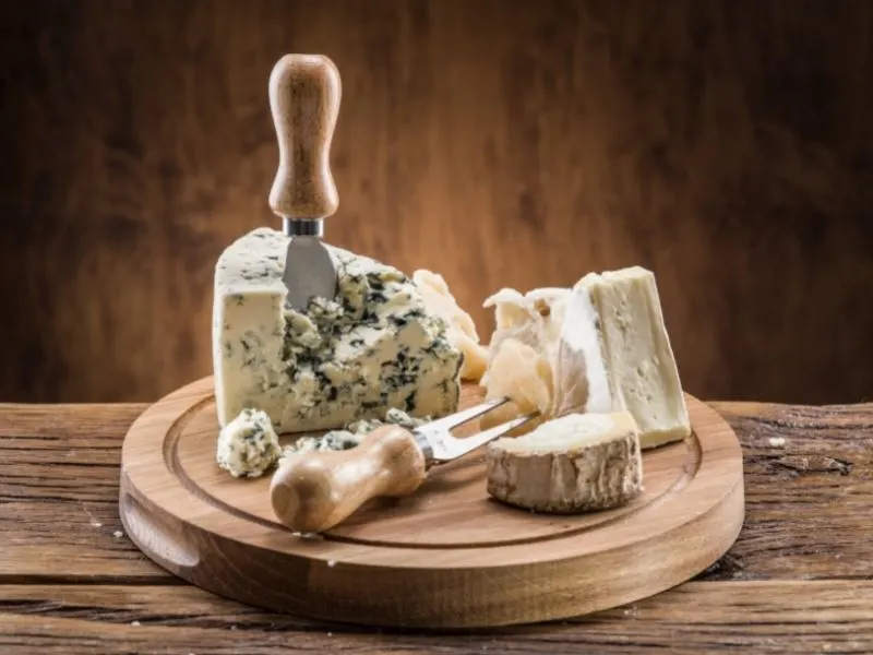 selection of blue cheese on a cheese board