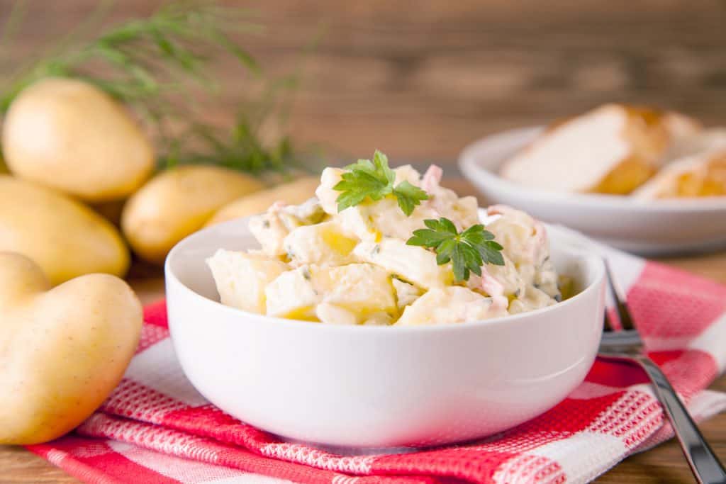 charlotte potatoes next to a prepared potato salad recipe