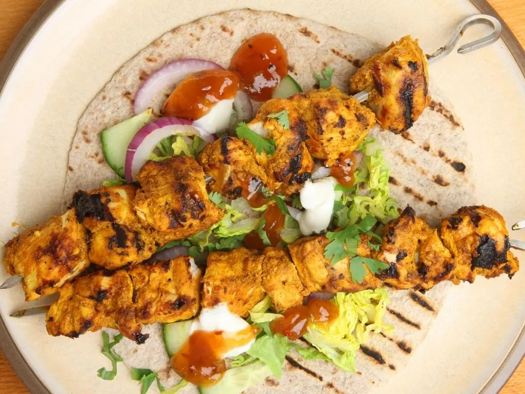 Chicken tikka kebabs in tortilla wrap