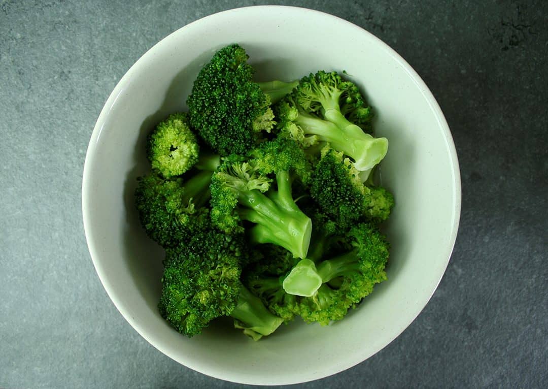 Cooked broccoli in bowl