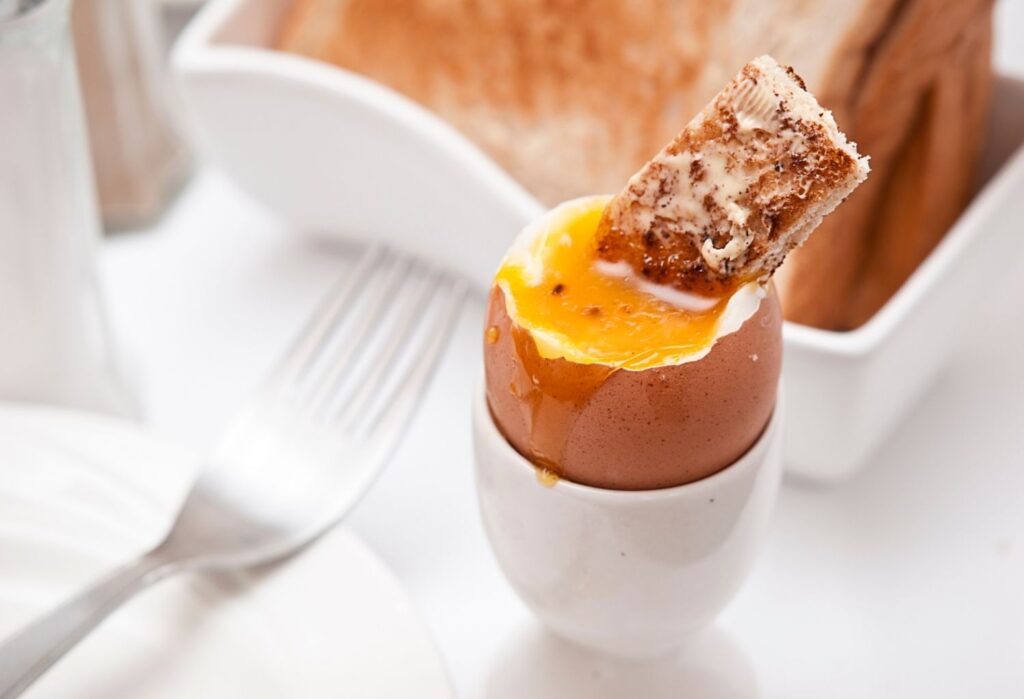egg and soldiers (toast dipped into boiled egg)
