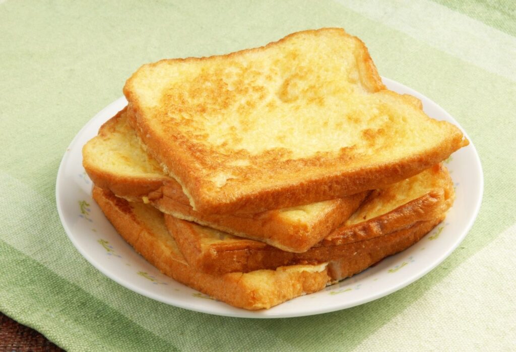4 slices of eggy bread on a plate