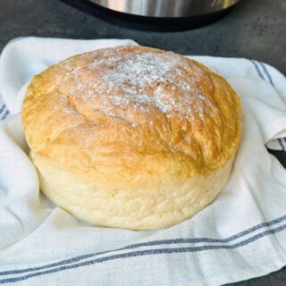 Floured bread on tea towel with Ninja in background