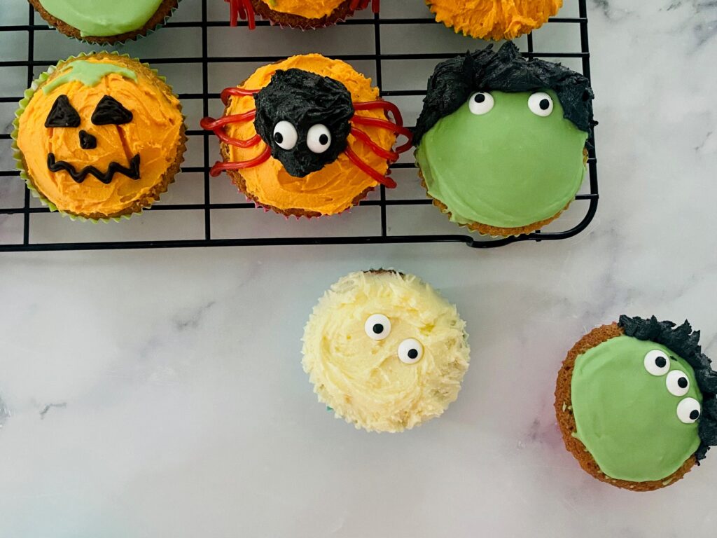 Halloween Cupcakes decorated on a wire rack