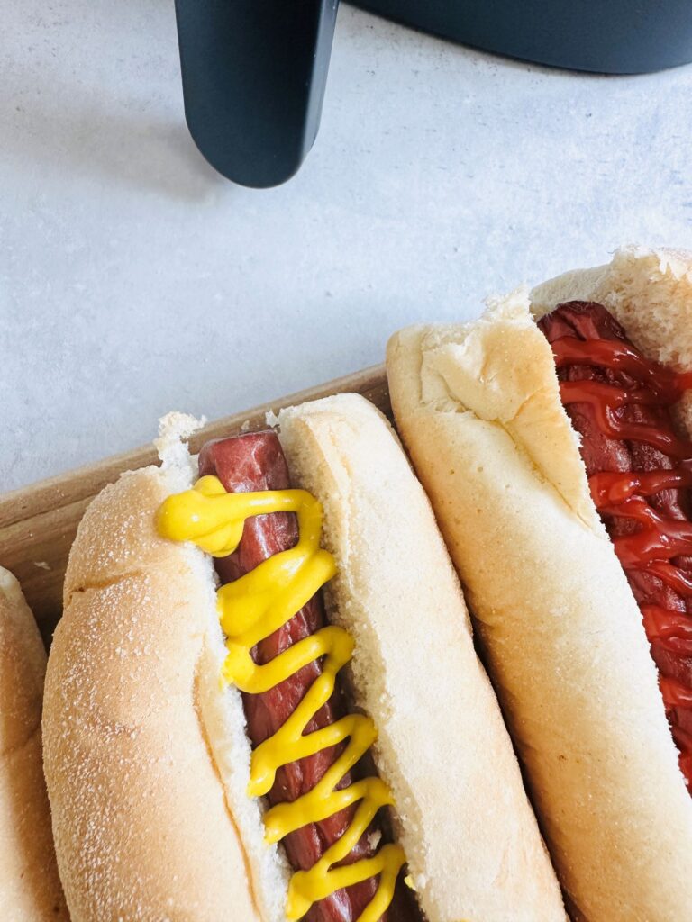 hot dogs next to air fryer