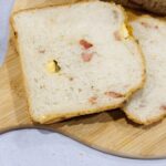 slice of bacon and cheese bread made in a Panasonic bread maker