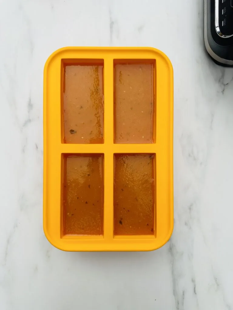 soup freezer container with soup poured into each compartment