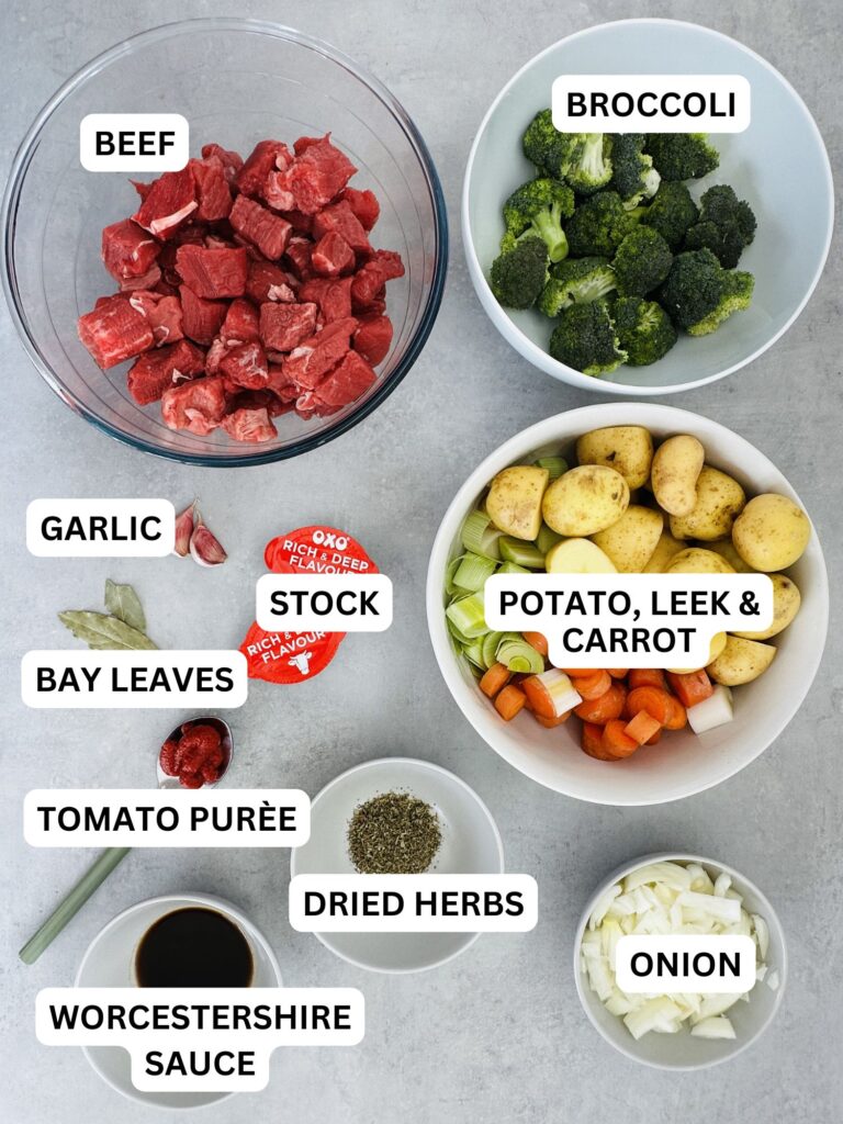 ingredients laid out and labelled for a beef stew made in a pressure cooker