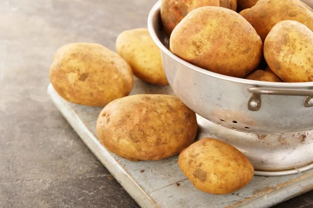 preparing King Edward potatoes in colander