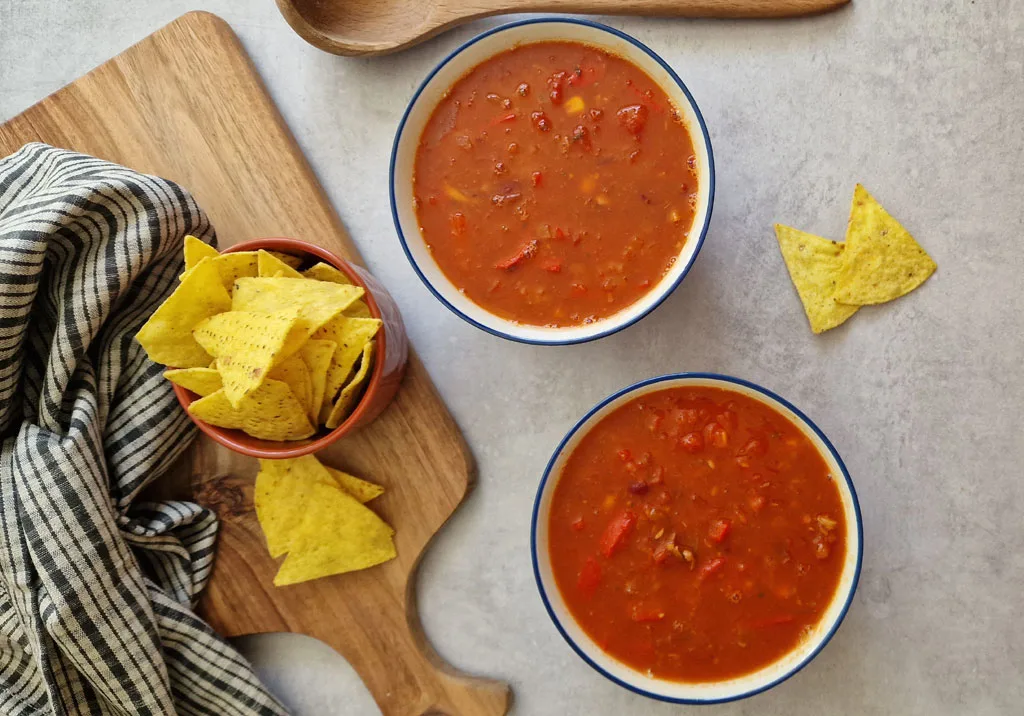 Mexican Bean Soup in bowls with tortilla crisps
