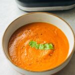 Moroccan chickpea soup in a bowl in front of a ninja soup maker