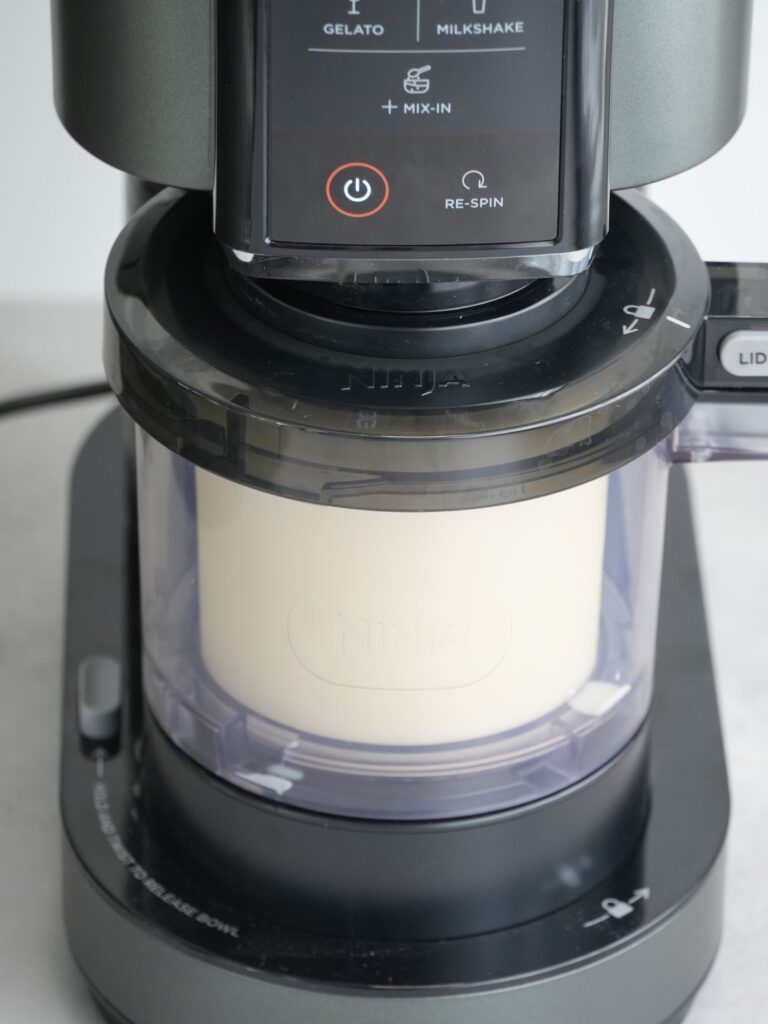 ninja creami with vanilla ice cream spinning