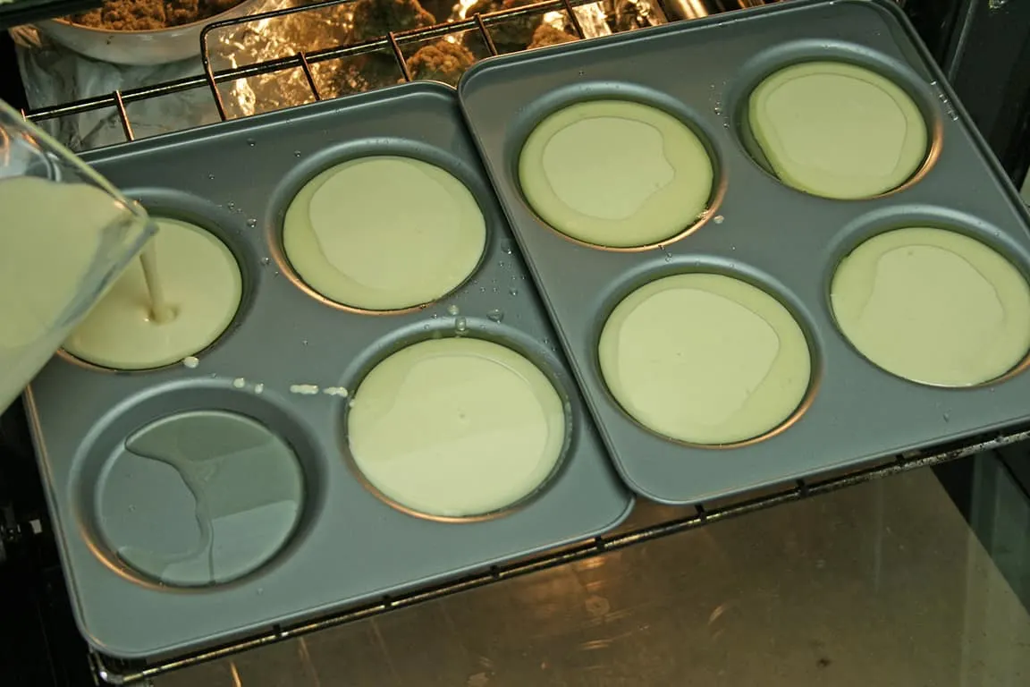 Pouring the batter into the hot trays