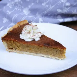 Pumpkin pie slice on plate