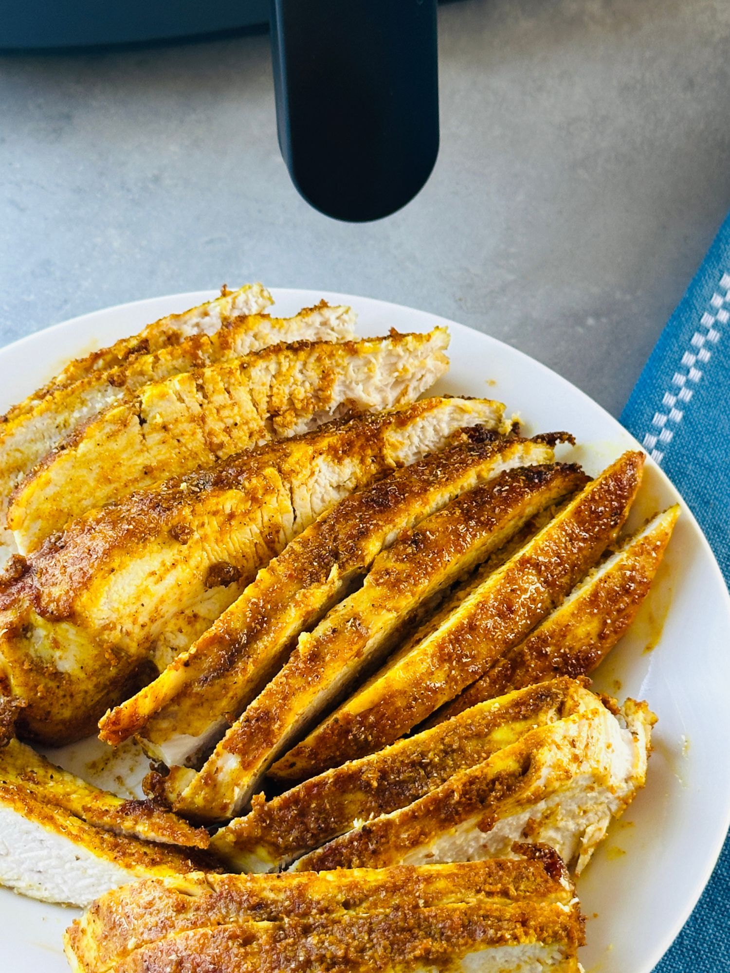 Sliced Moroccan style air fryer chicken breasts