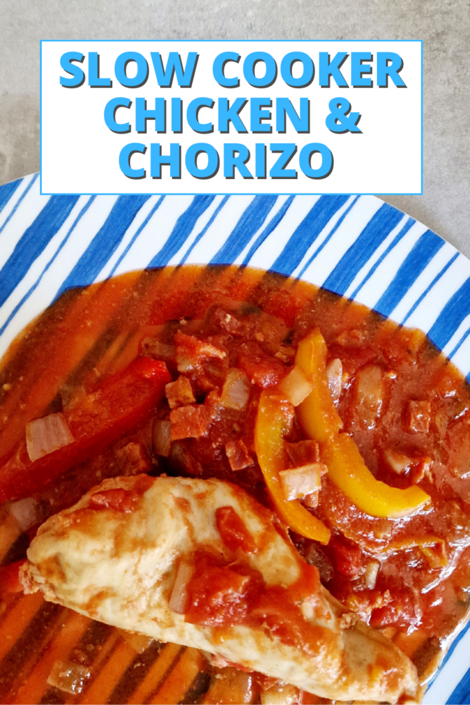 slow cooker chicken and chorizo on a blue plate
