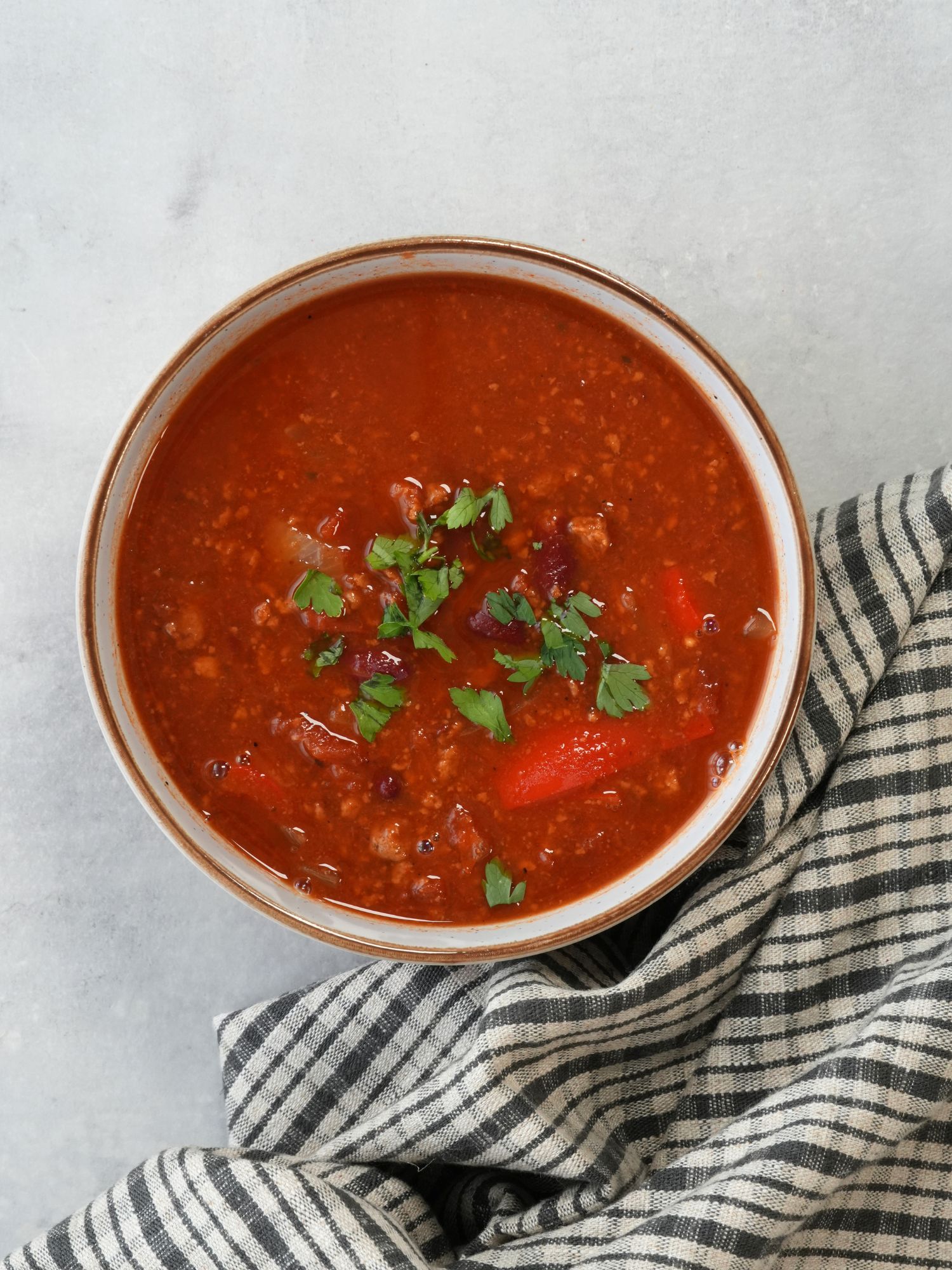 Quorn vegetarin mince soup in a bowl with fresh coriander sprinkled on top