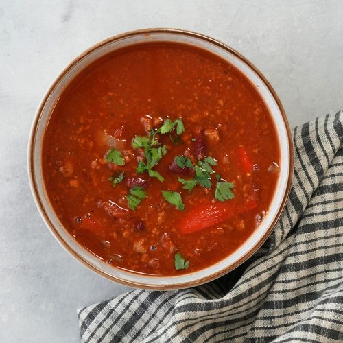 Quorn vegetarin mince soup in a bowl with fresh coriander sprinkled on top