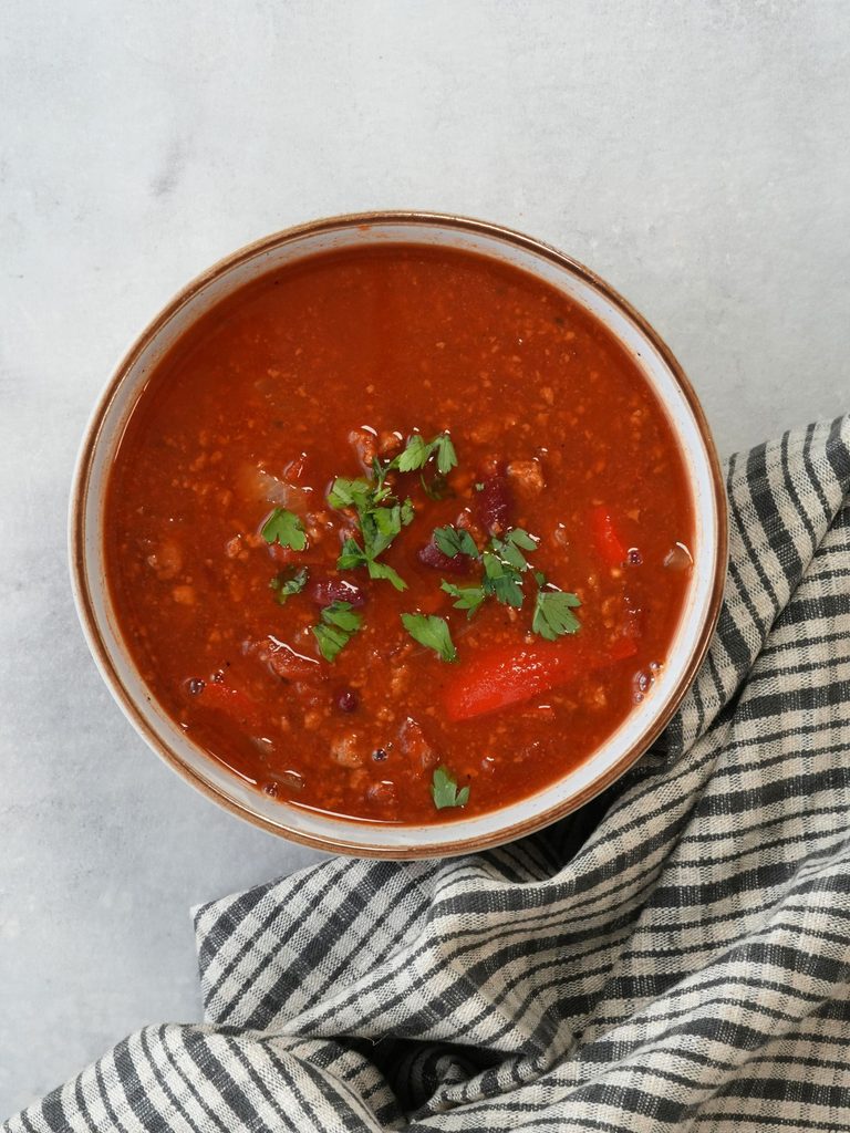 Quorn vegetarin mince soup in a bowl with fresh coriander sprinkled on top