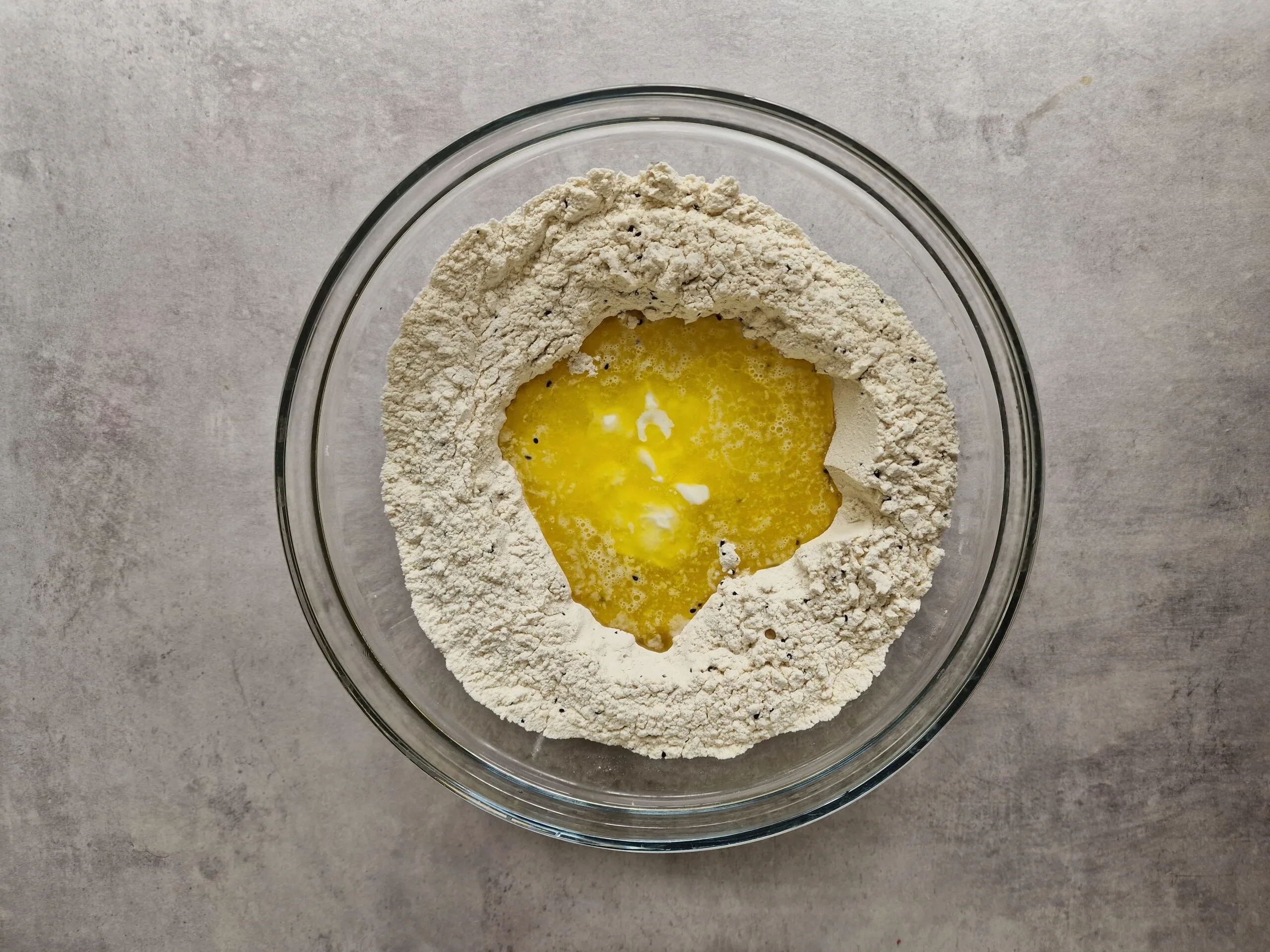 Wet ingredients added to flour well