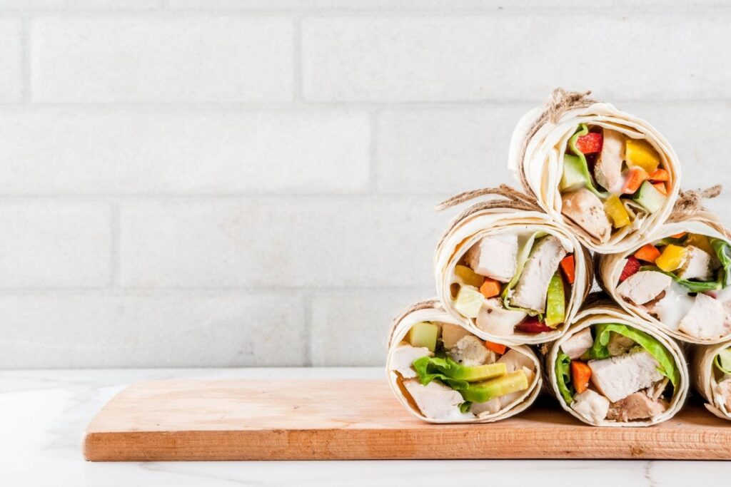 wraps piled up on chopping board