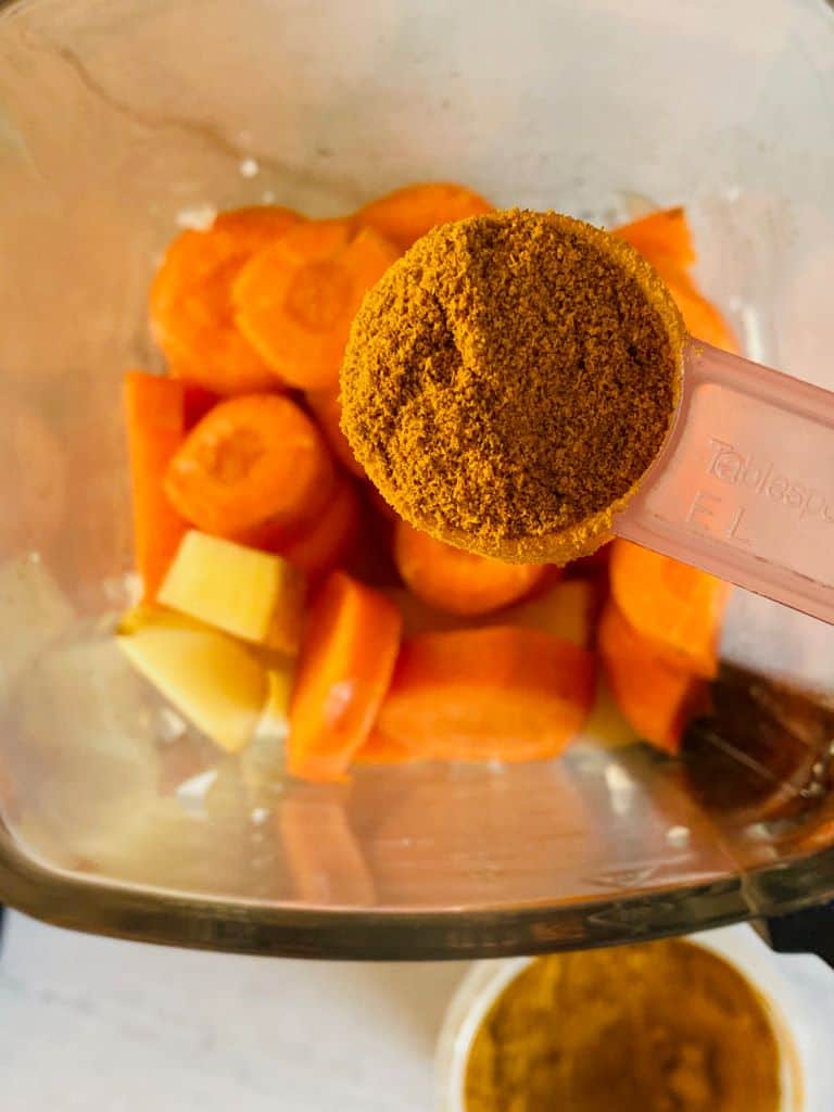 add curry powder to soup maker with chopped vegetables below