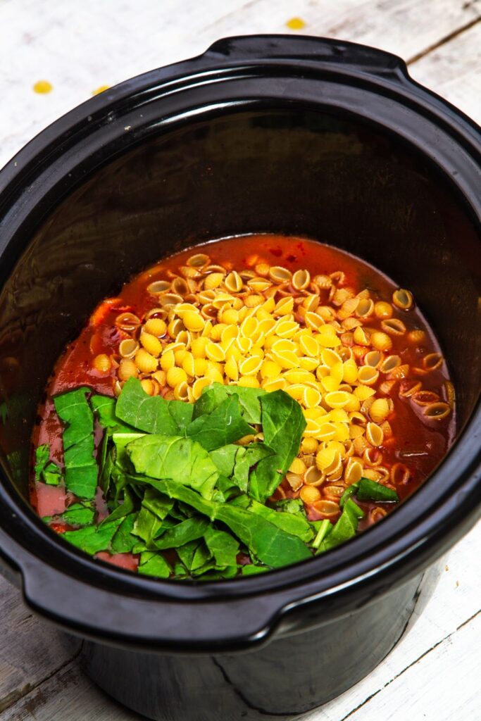 adding pasta to minestrone soup