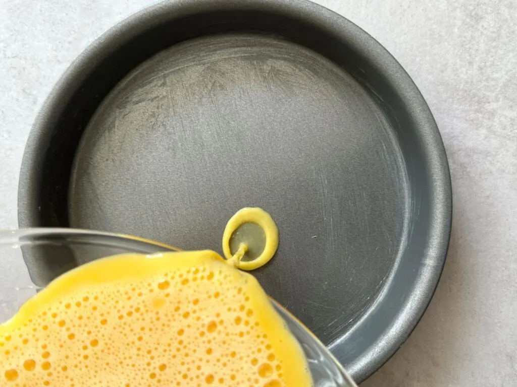 pour egg mixture in greased pan to make scrambled eggs in an air fryer