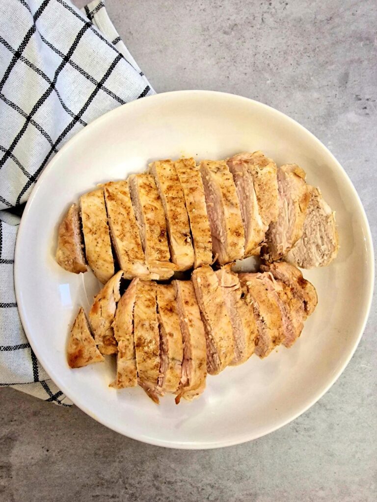 air fryer chicken breast sliced and on plate