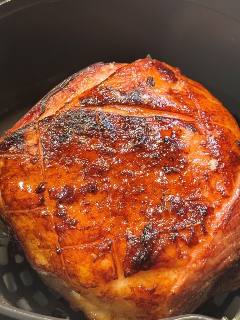 adding glaze to a slow cooked gammon and cooking in the air fryer