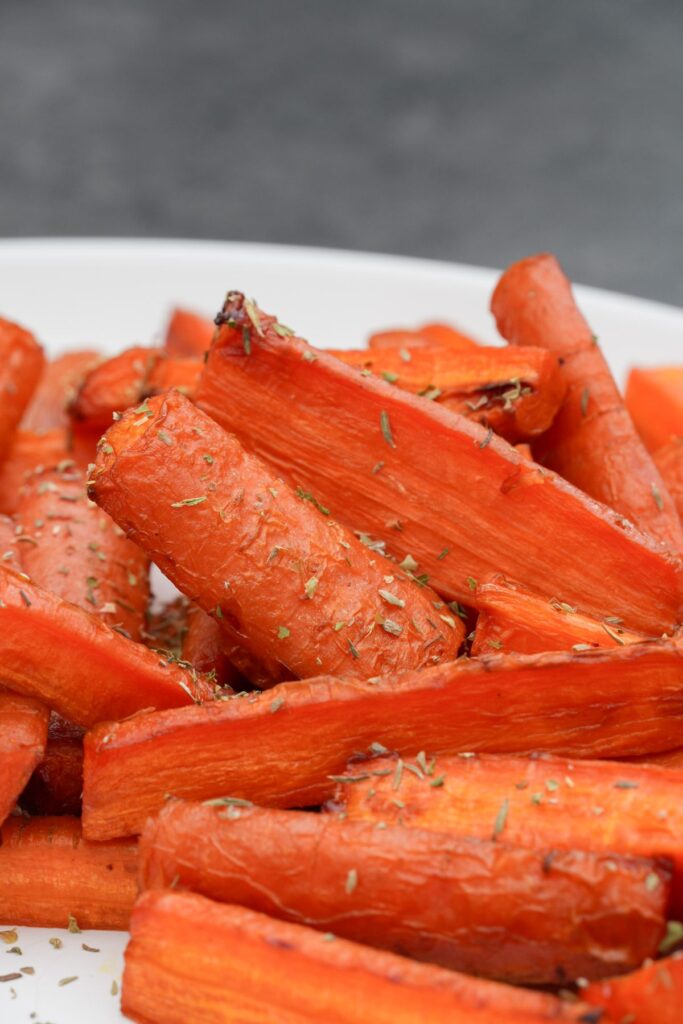 roasted carrots cooked in an air fryer with dried herbs and honey 