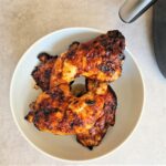 piri piri chicken legs next to air fryer