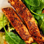 air fried salmon on plate with salad