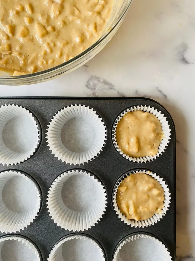 apple muffin batter in cupcake cases