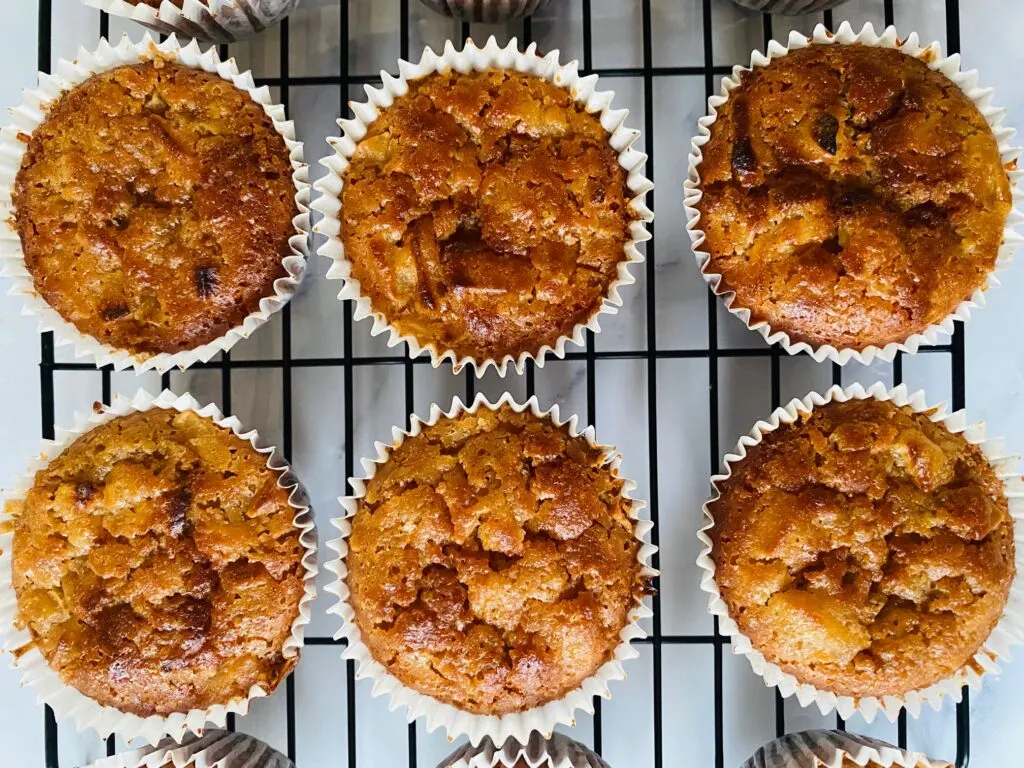 cooked apple muffins on wire rack