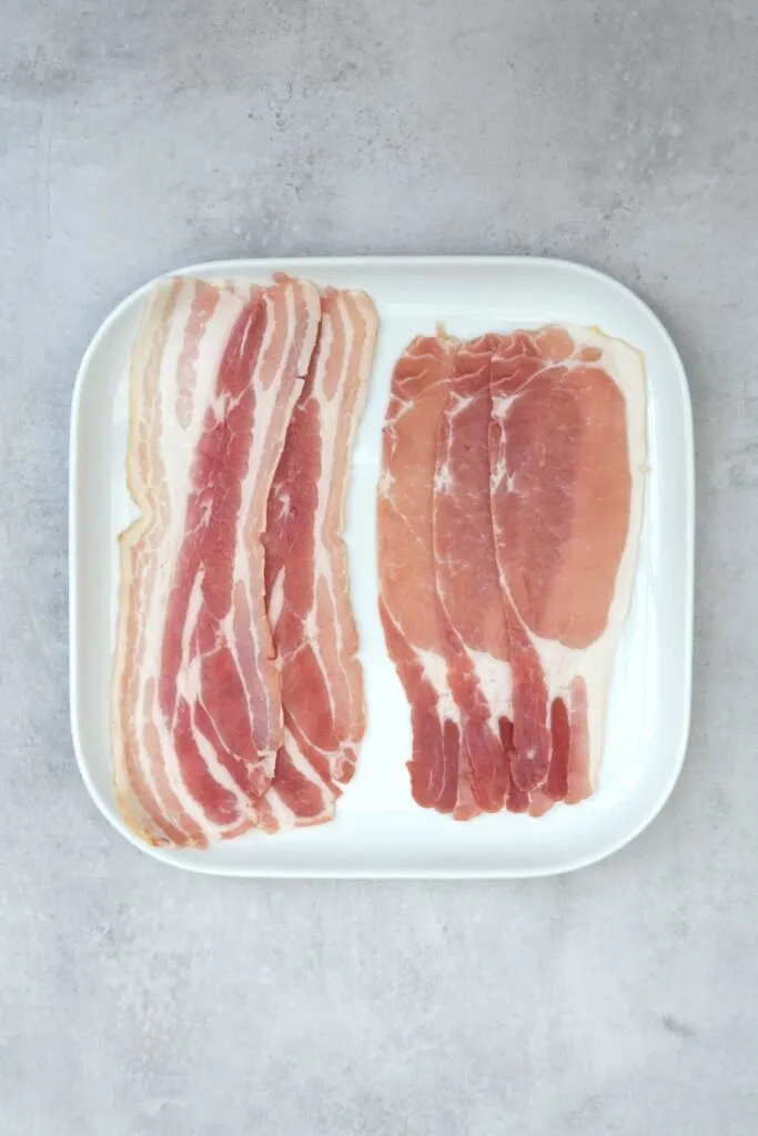 raw back bacon and bacon rashers on a white plate